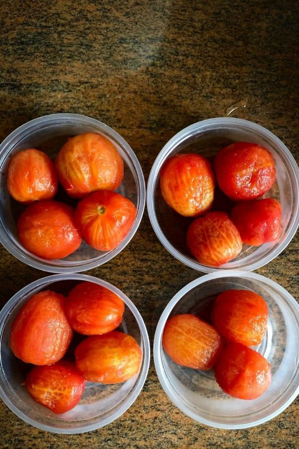 Peeled tomatoes in containers